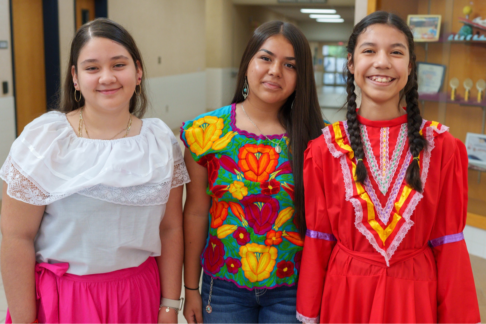 teen girls dressed in Hispanic traditional dresses