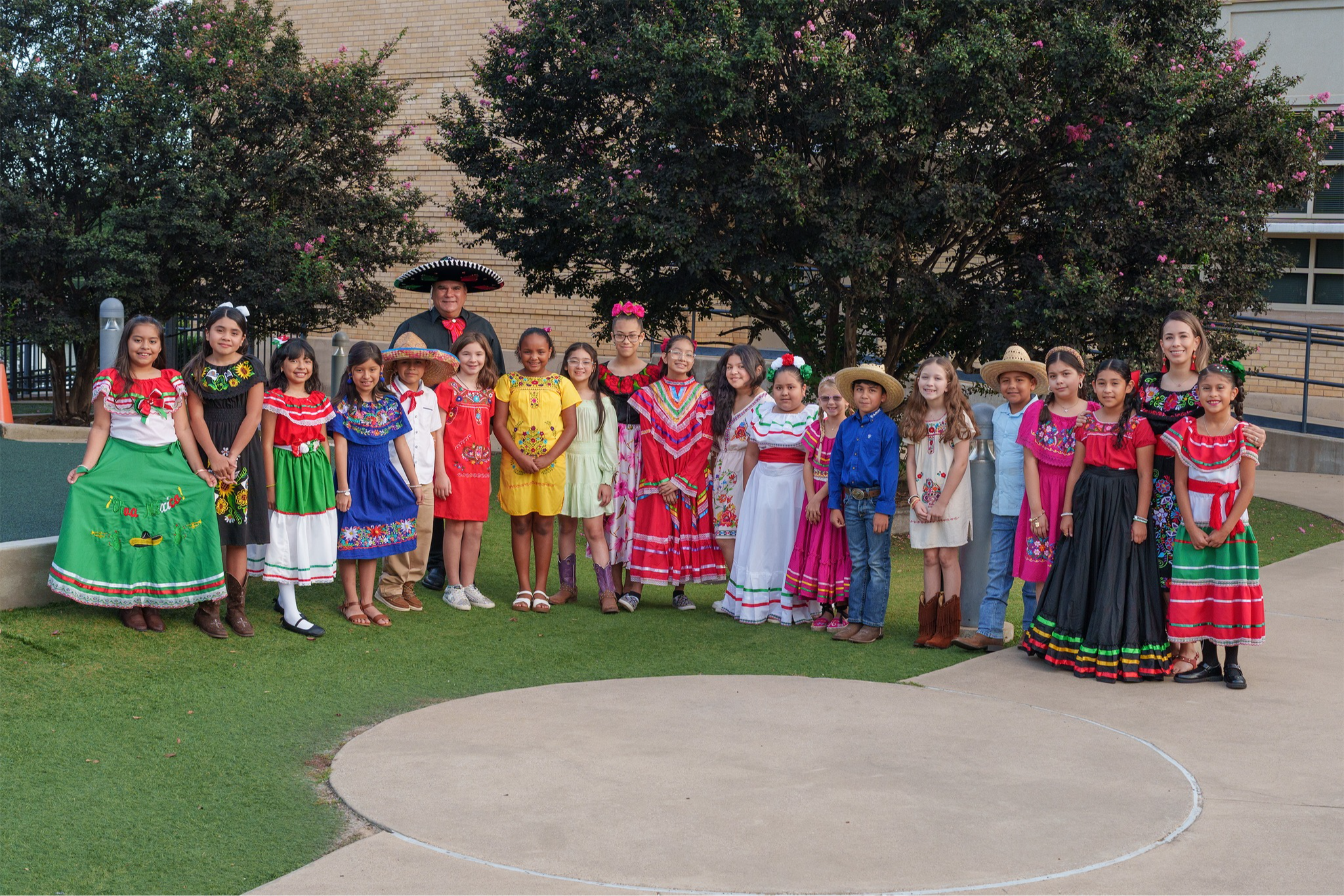 elementary aged children dressed in Hispanic traditional attire