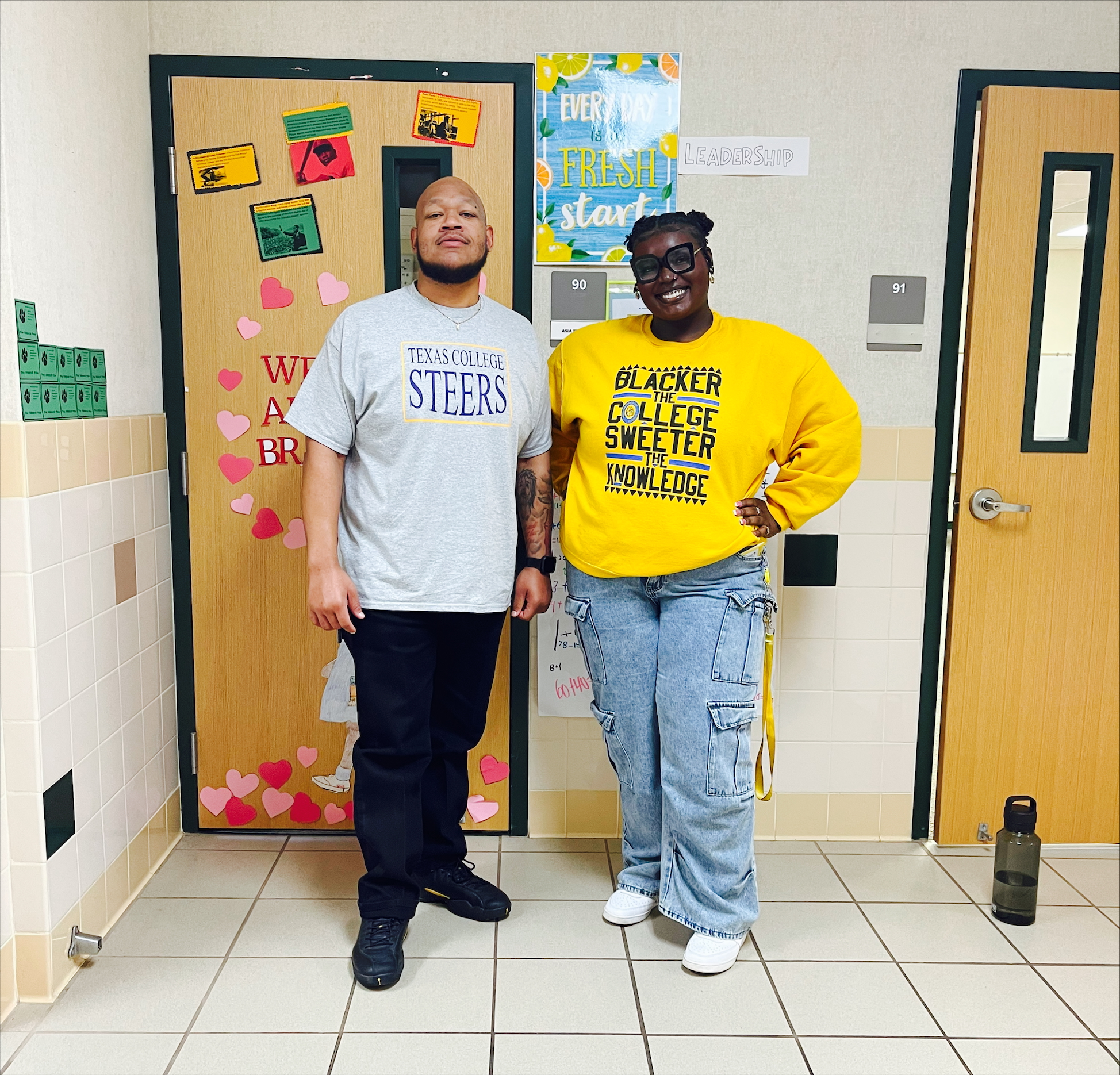 man and woman standing in hallway