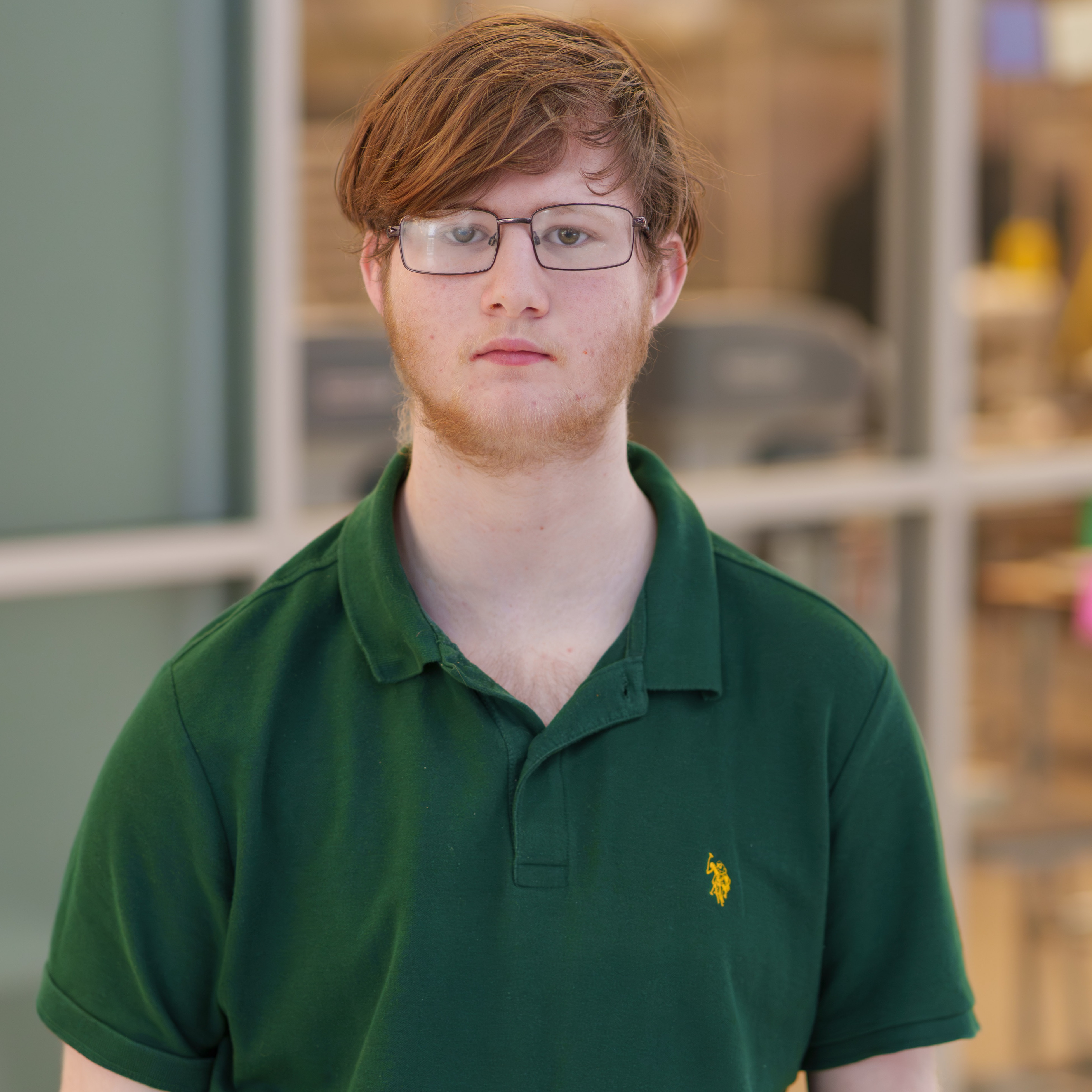 high school boy wearing green polo