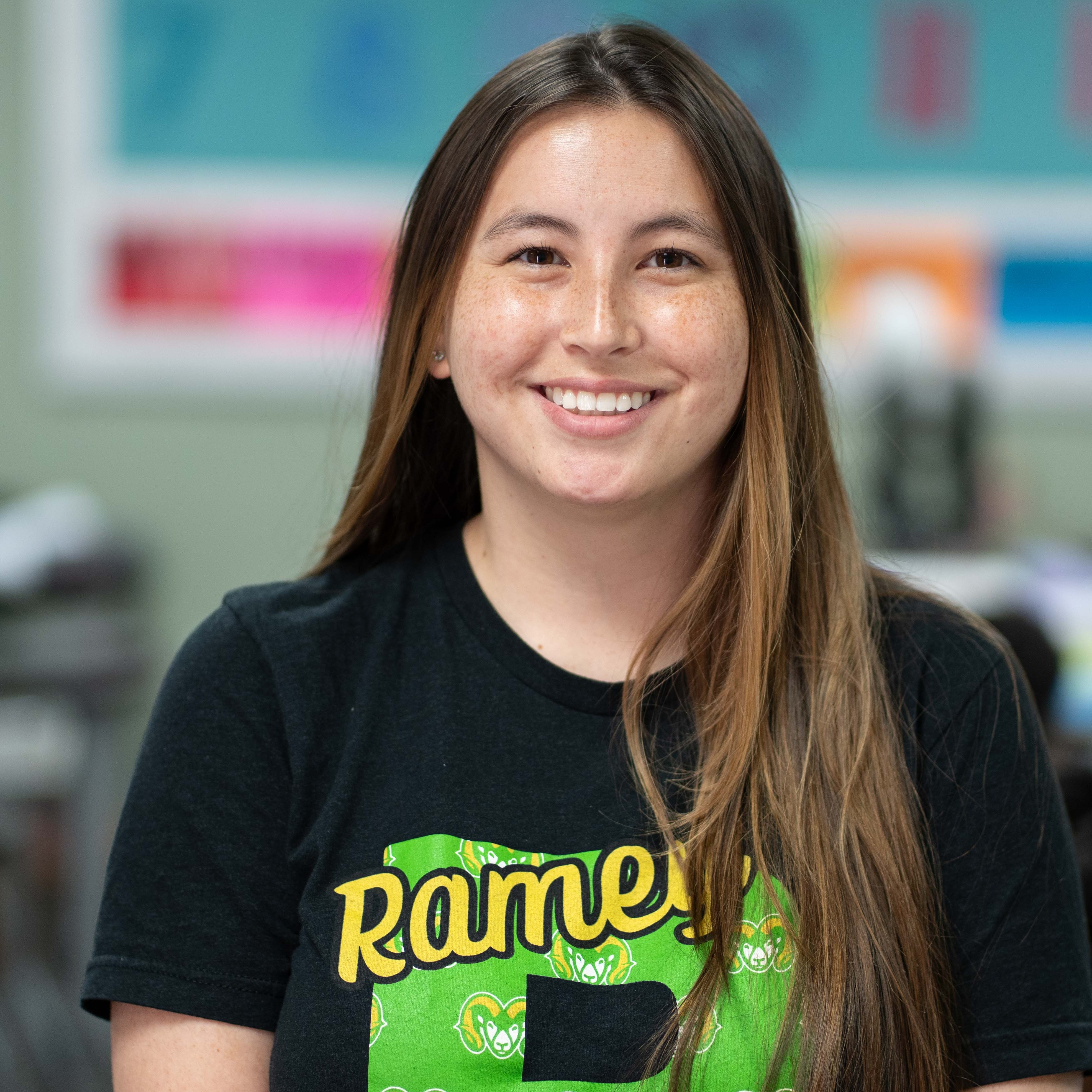 woman wearing plaid shirt in classroom