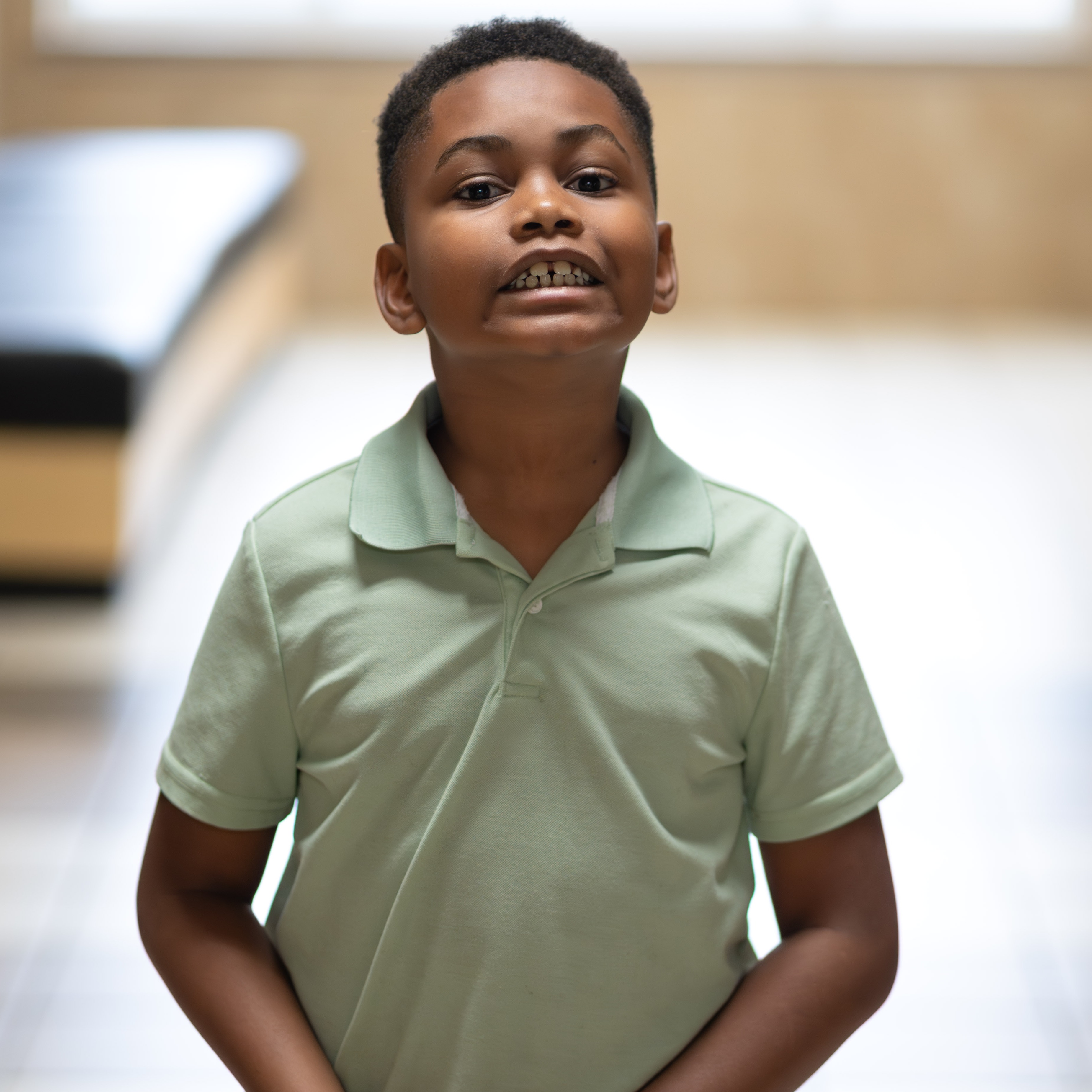 elementary age boy with a huge grin