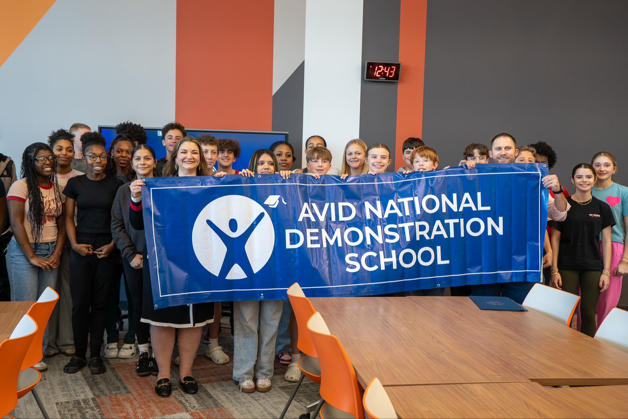 students posing with avid national demonstration school sign