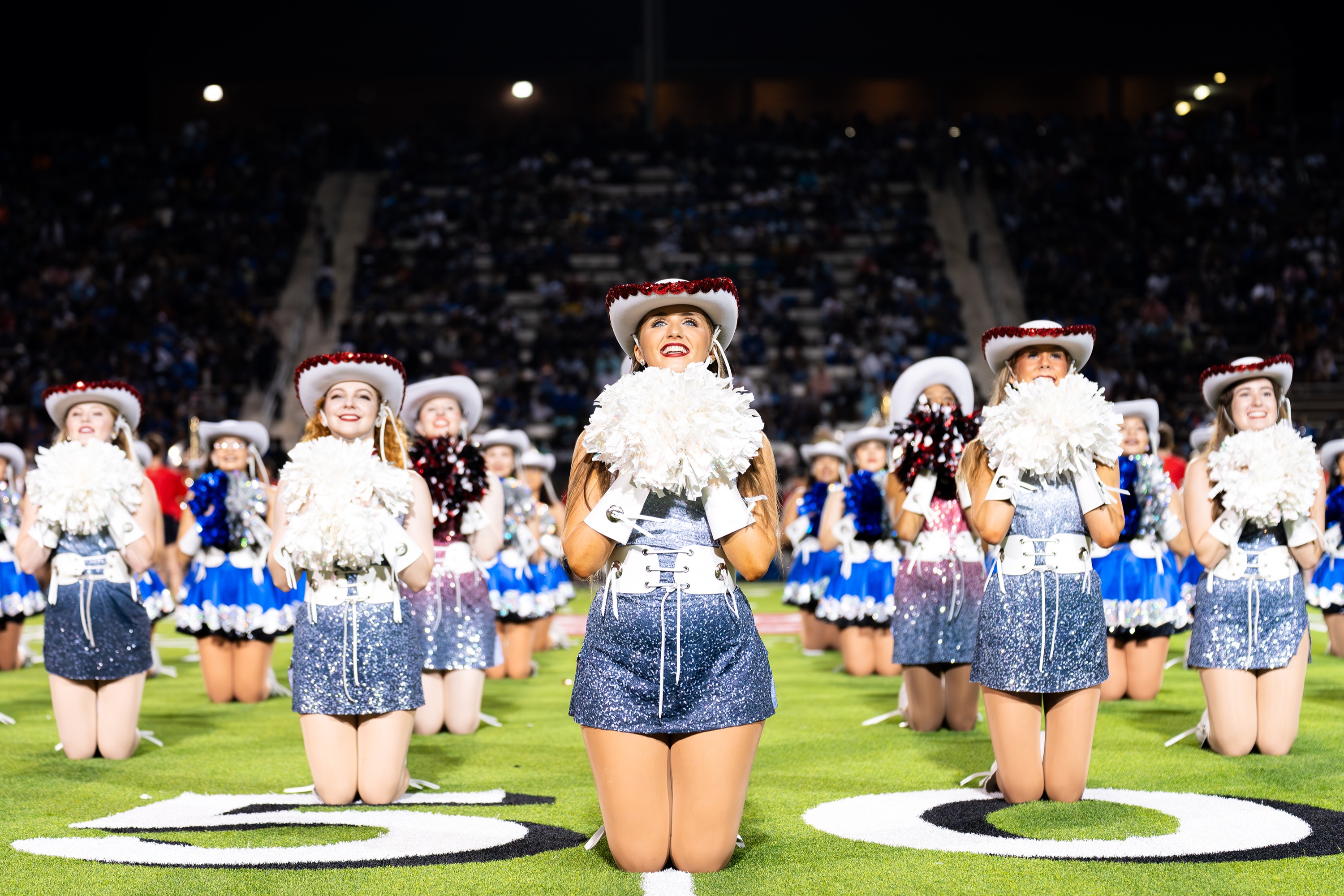 high school drill team girls on football field