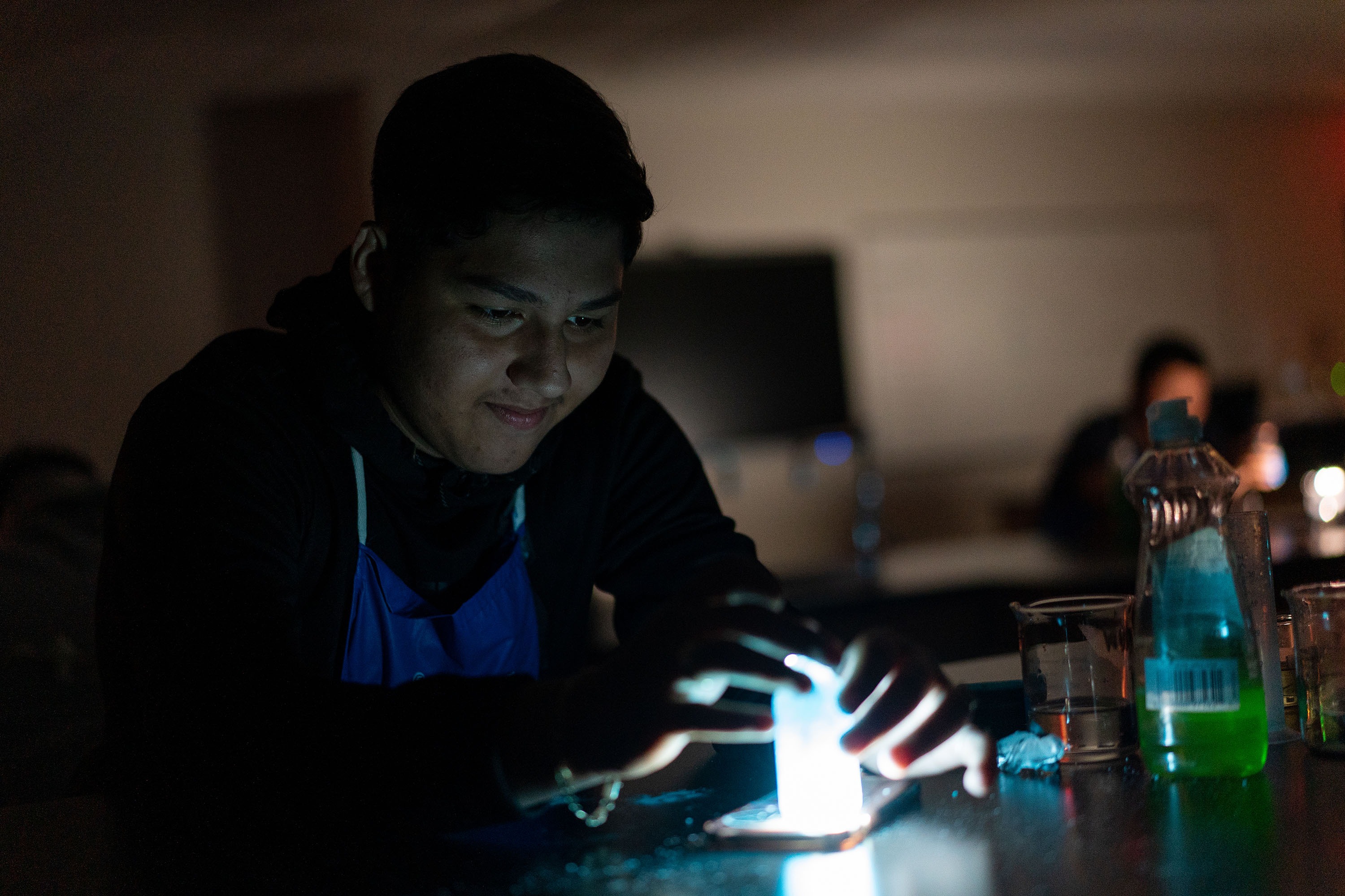 middle school students doing a science experiment