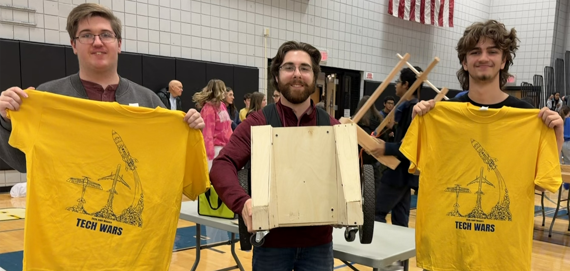 student and teacher pose at tech wars