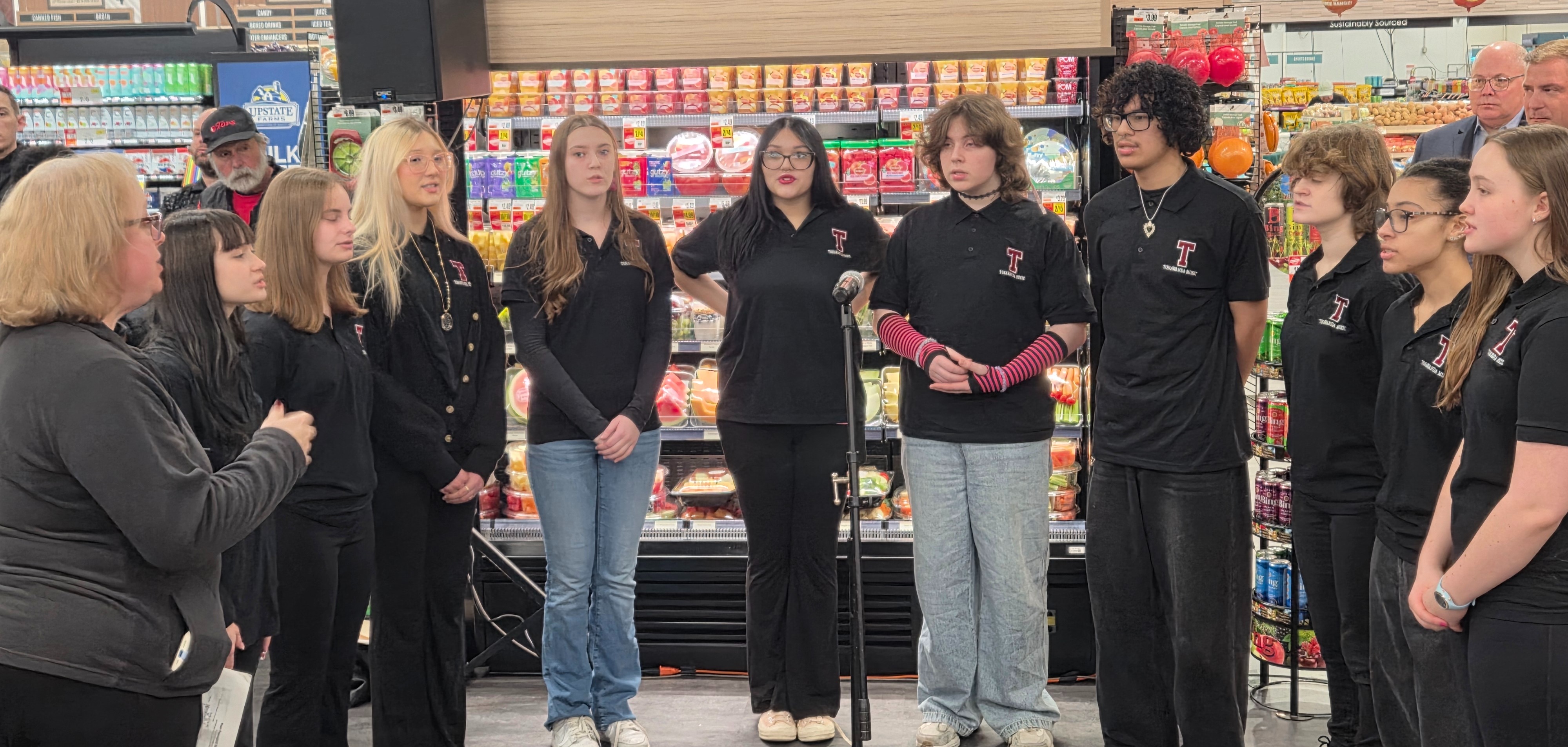 students singing at area Tops store