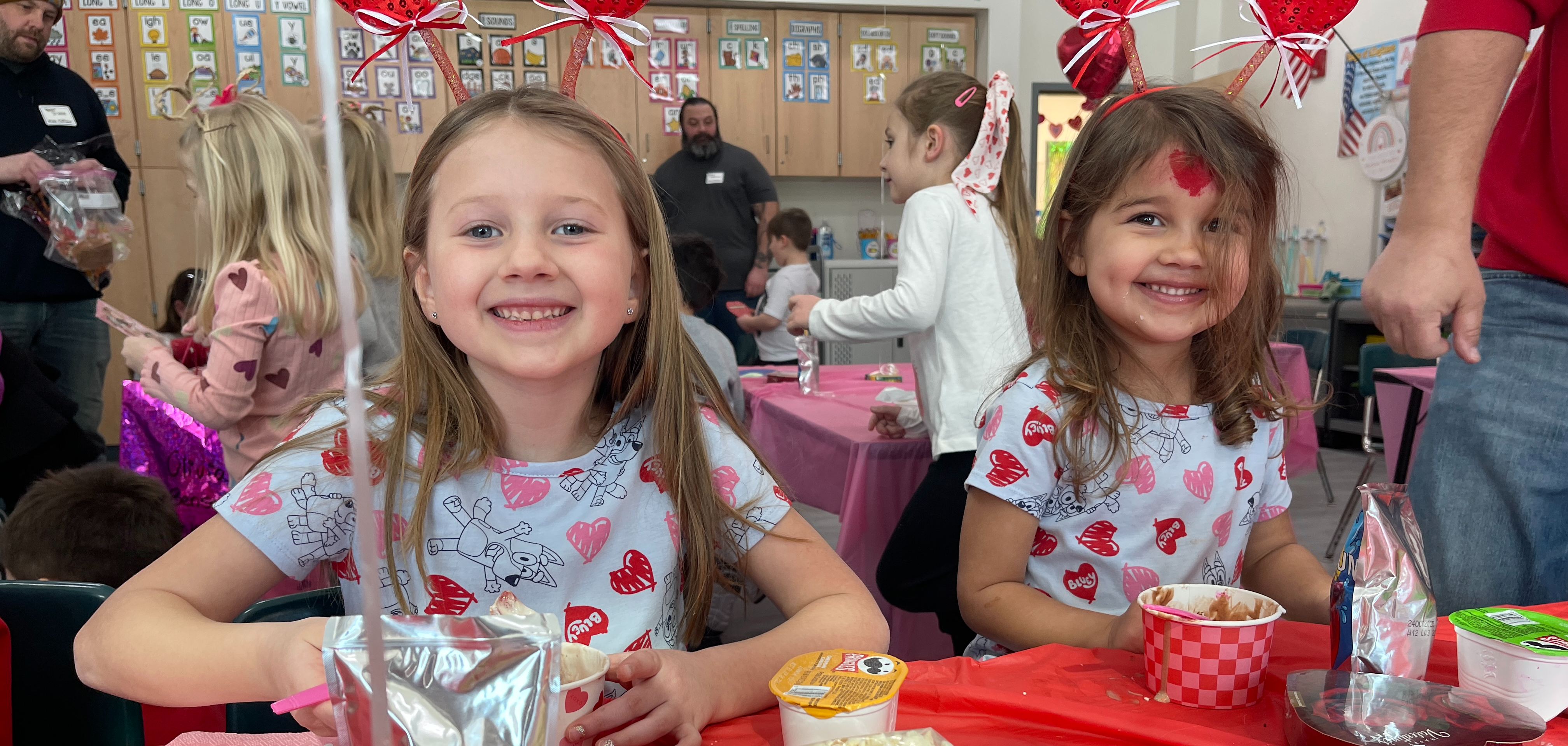 students pose in valentines day clothing