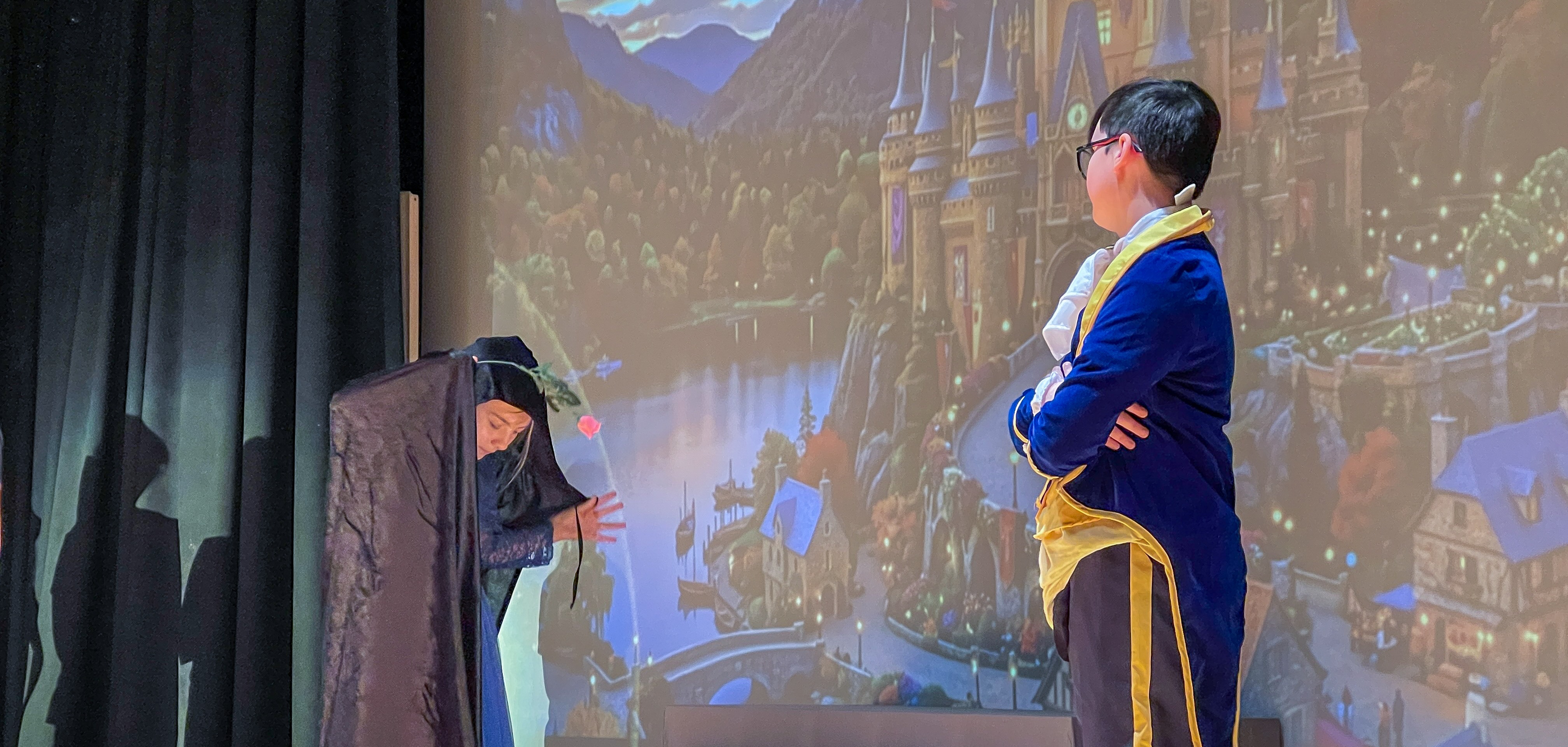 witch and beast on stage during opening scene of beauty and the beast