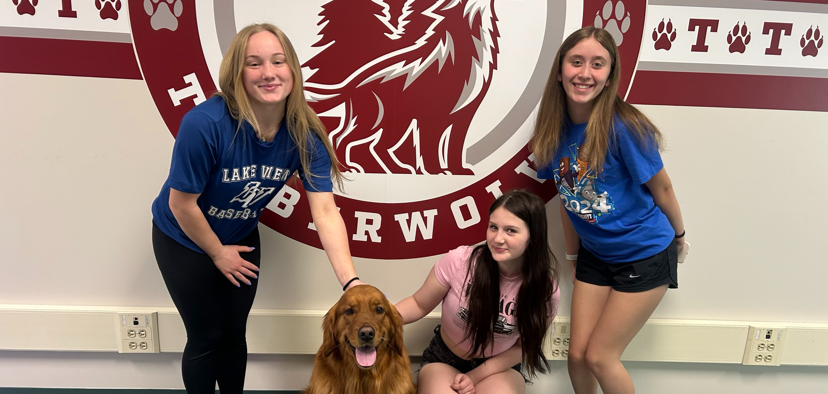 students pose with dog