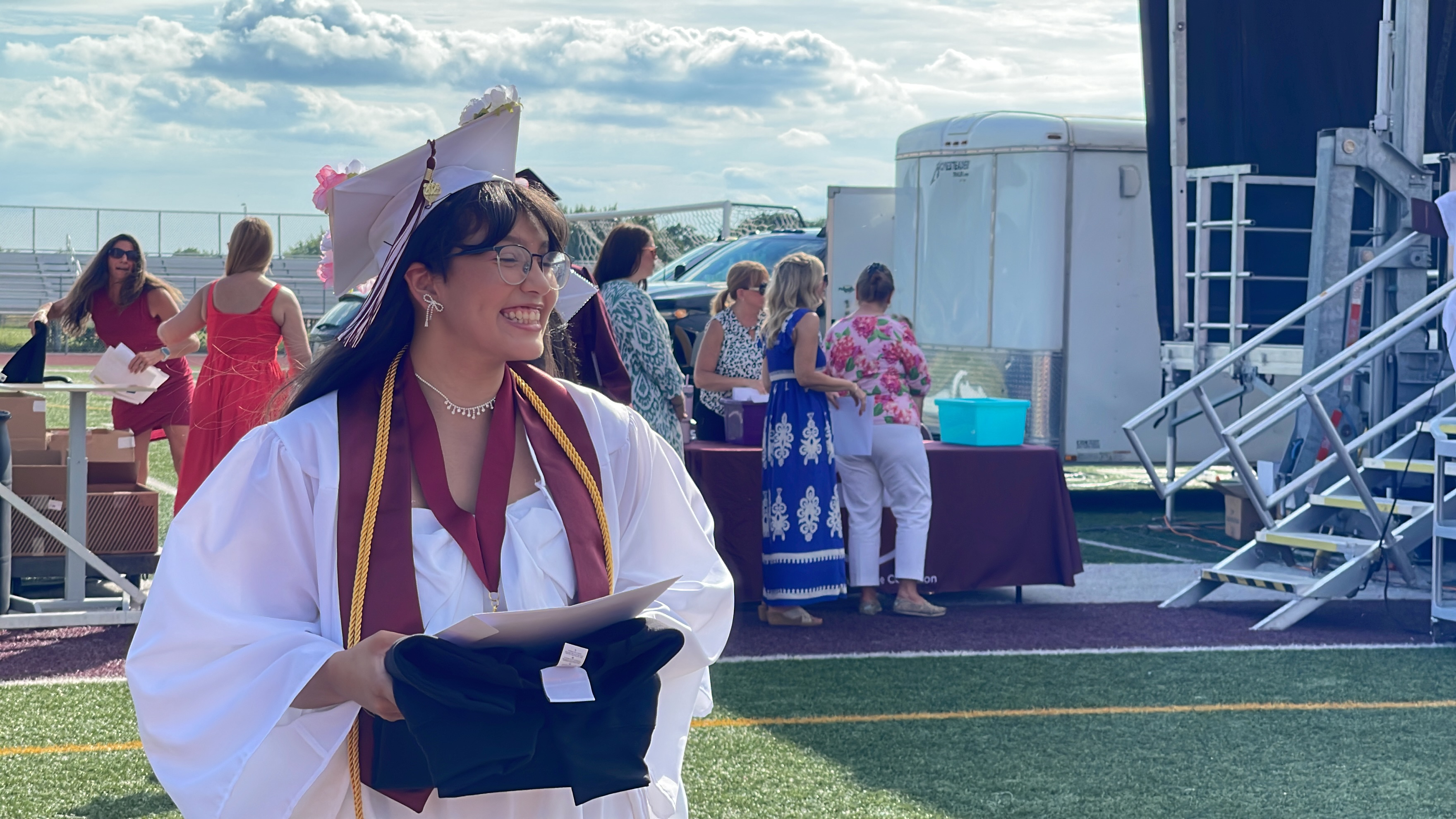 graduate smiles after receiving diploma