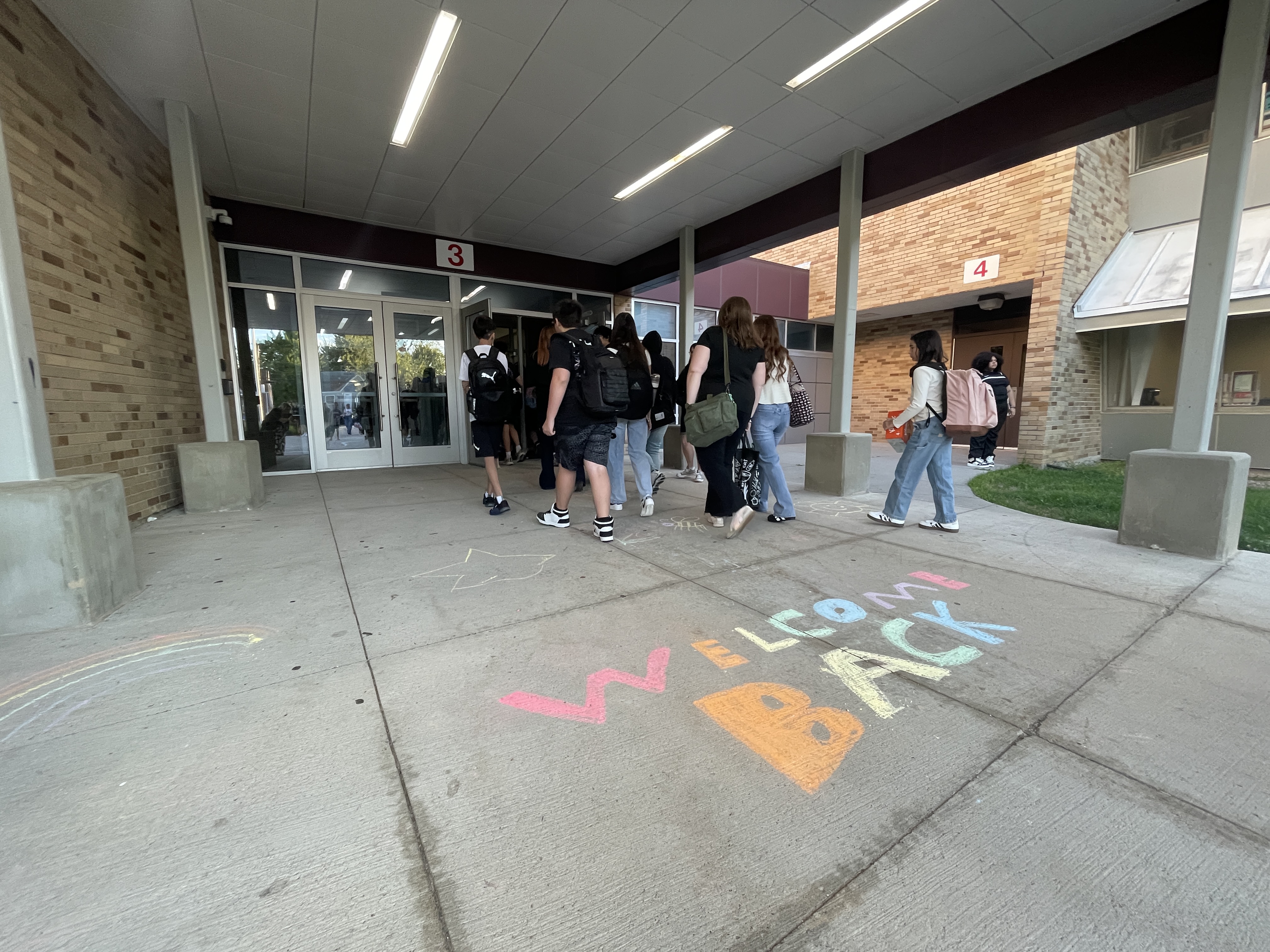 students walk into school for first day
