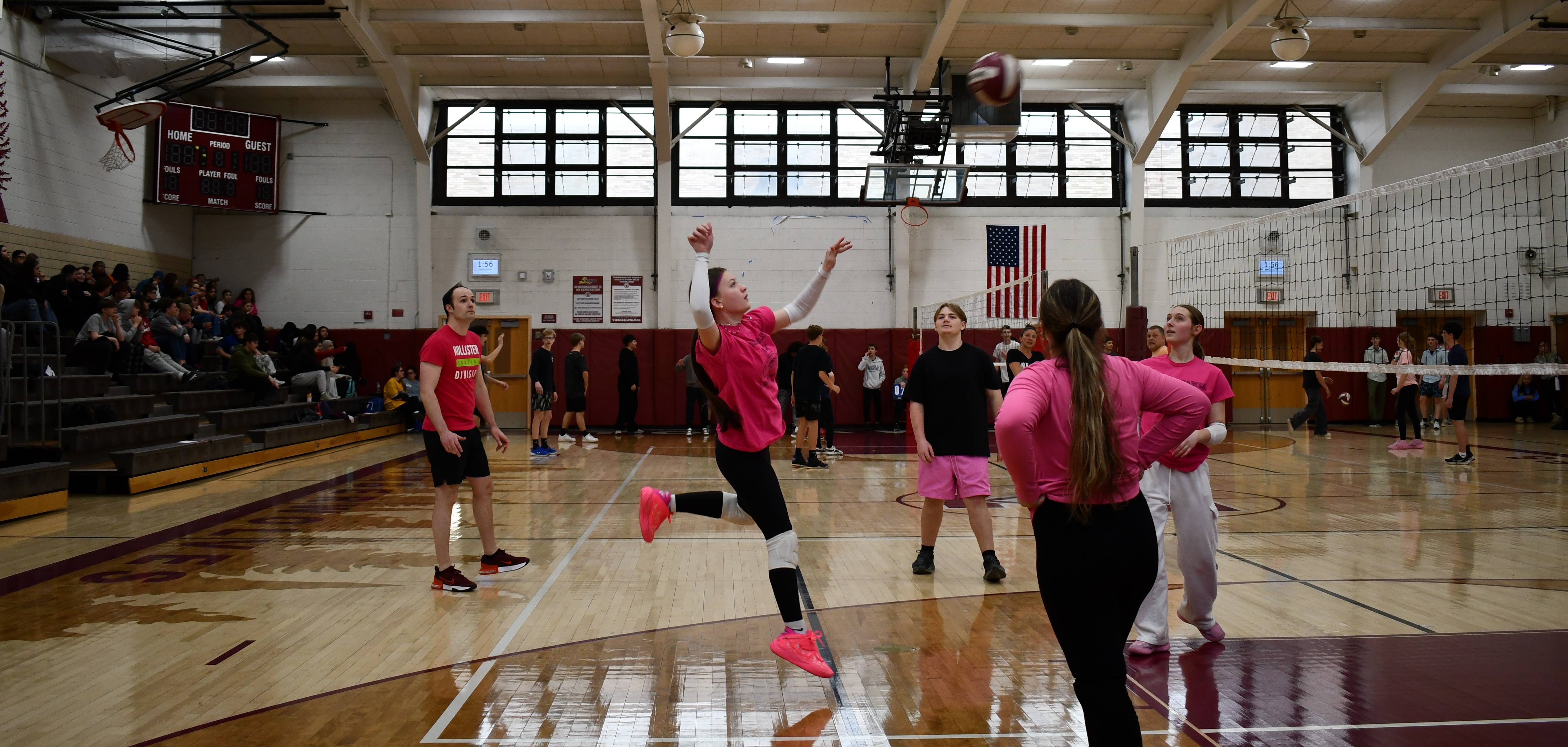students in gym participating in volleyball tournament