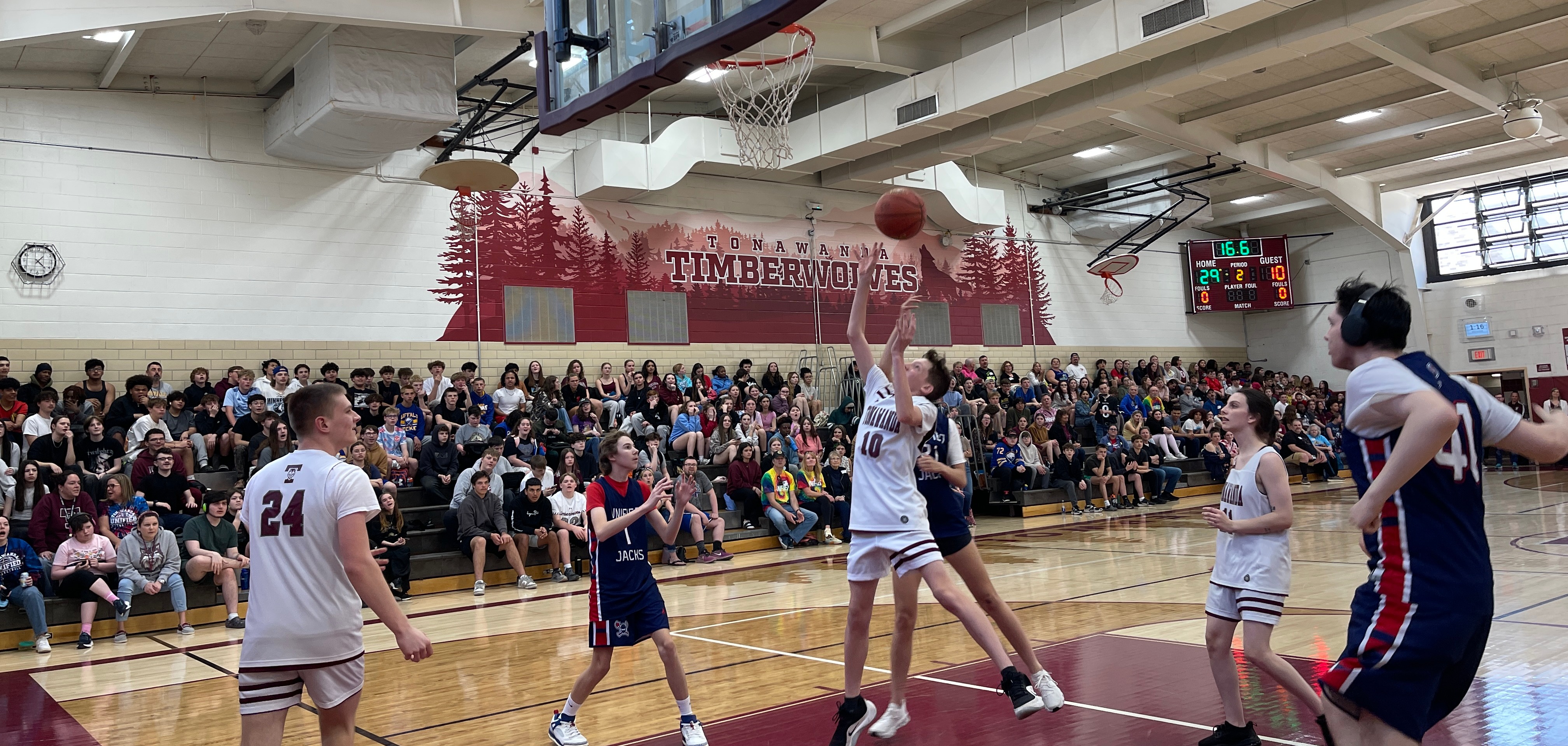 unified students playing on basketball court