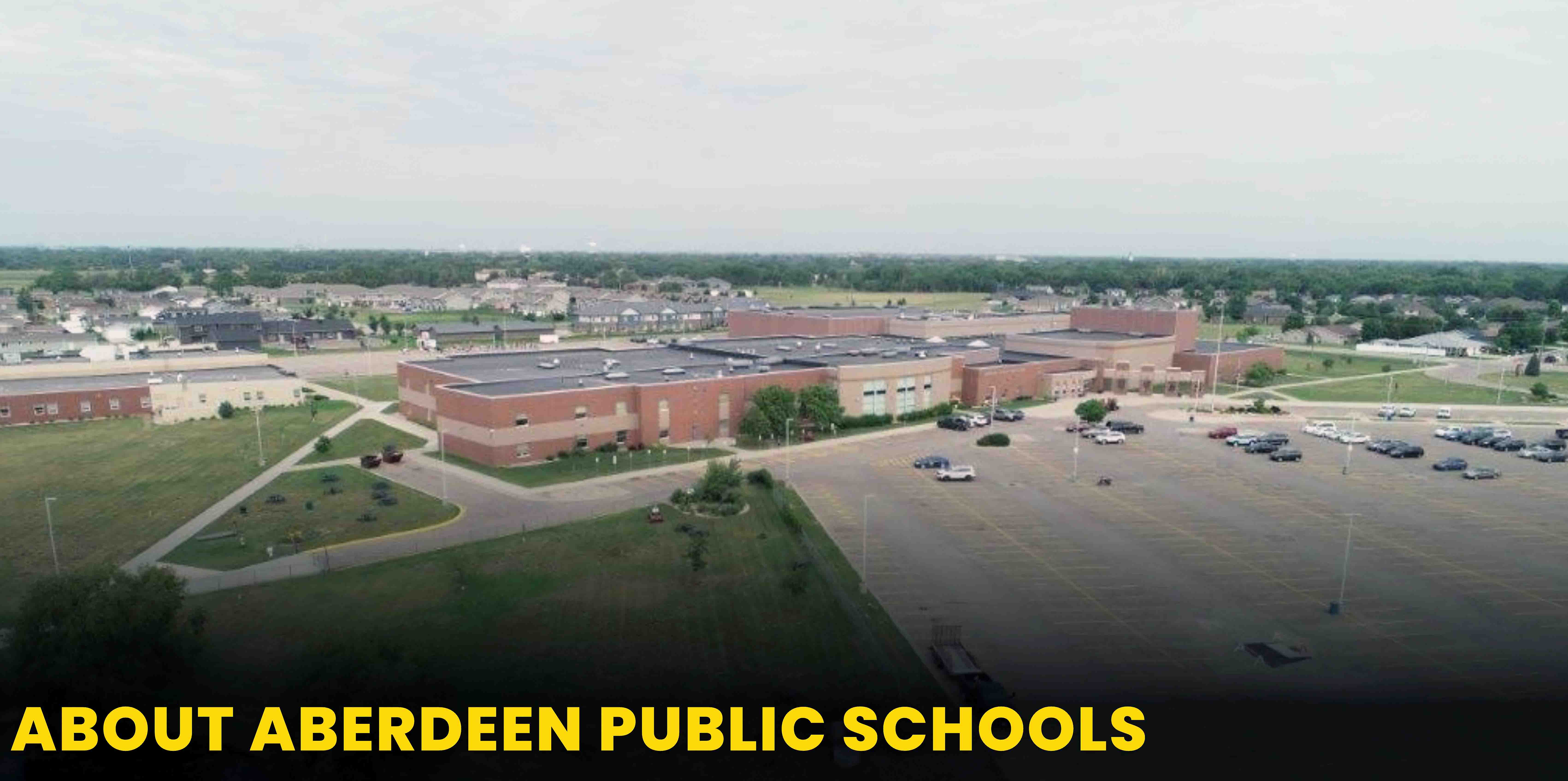 Aerial view of Aberdeen Central High School with text: About Aberdeen Public Schools