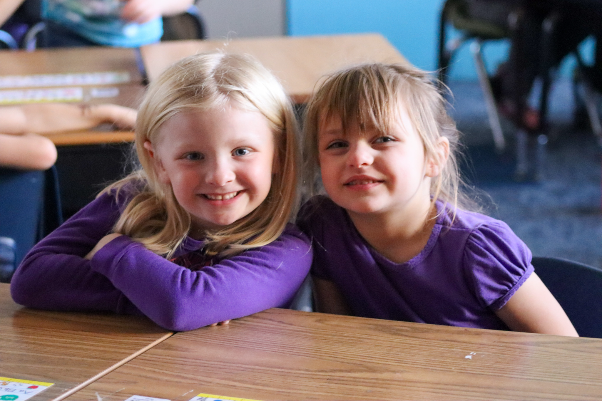 Kindergarten students smiling in the classroom