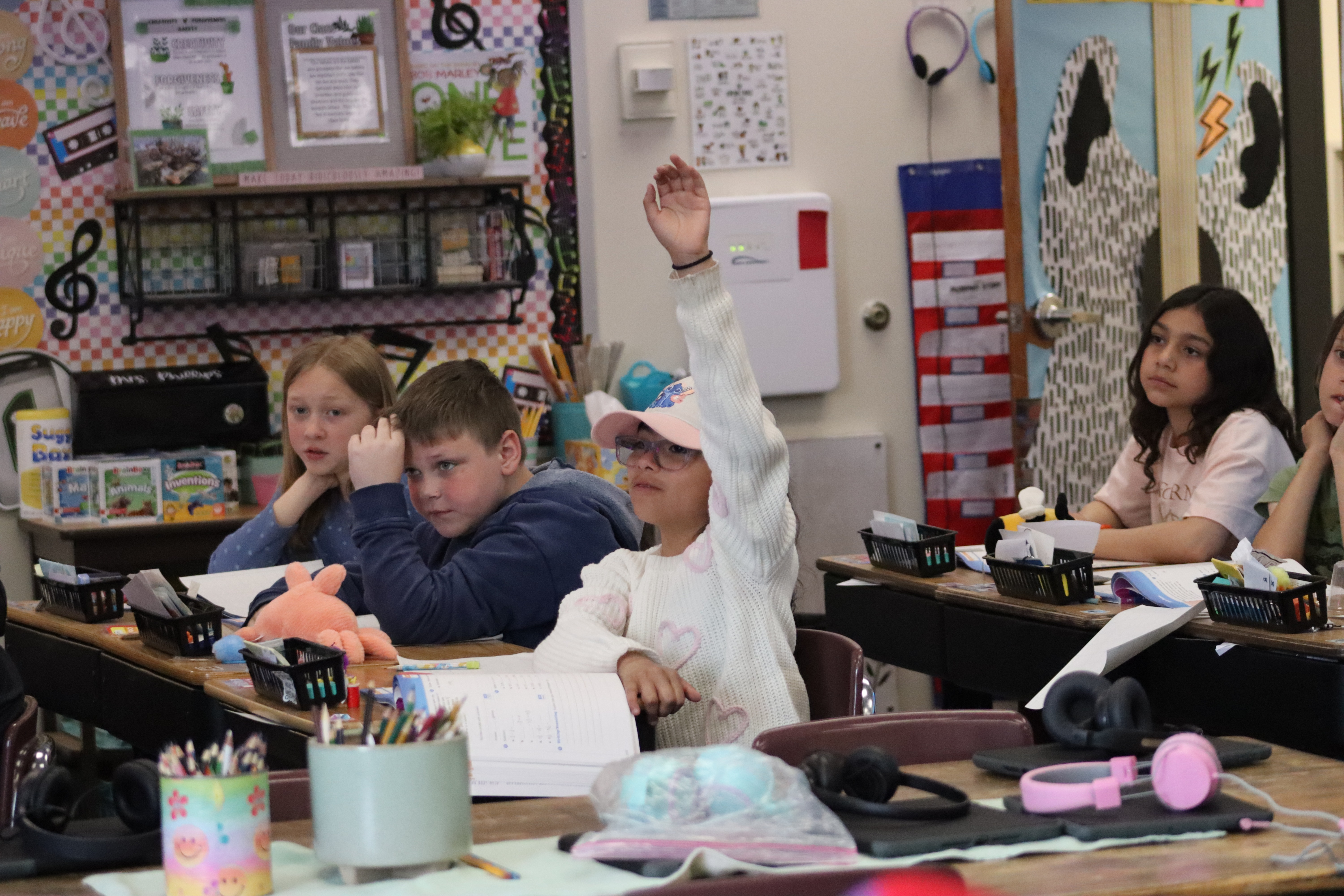 Student raising her hand in class