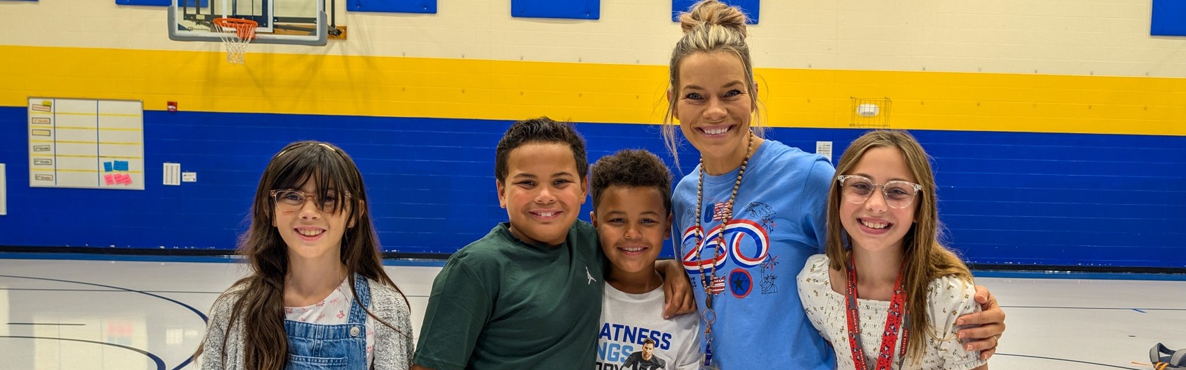 C.C. Lee teacher smiling with students