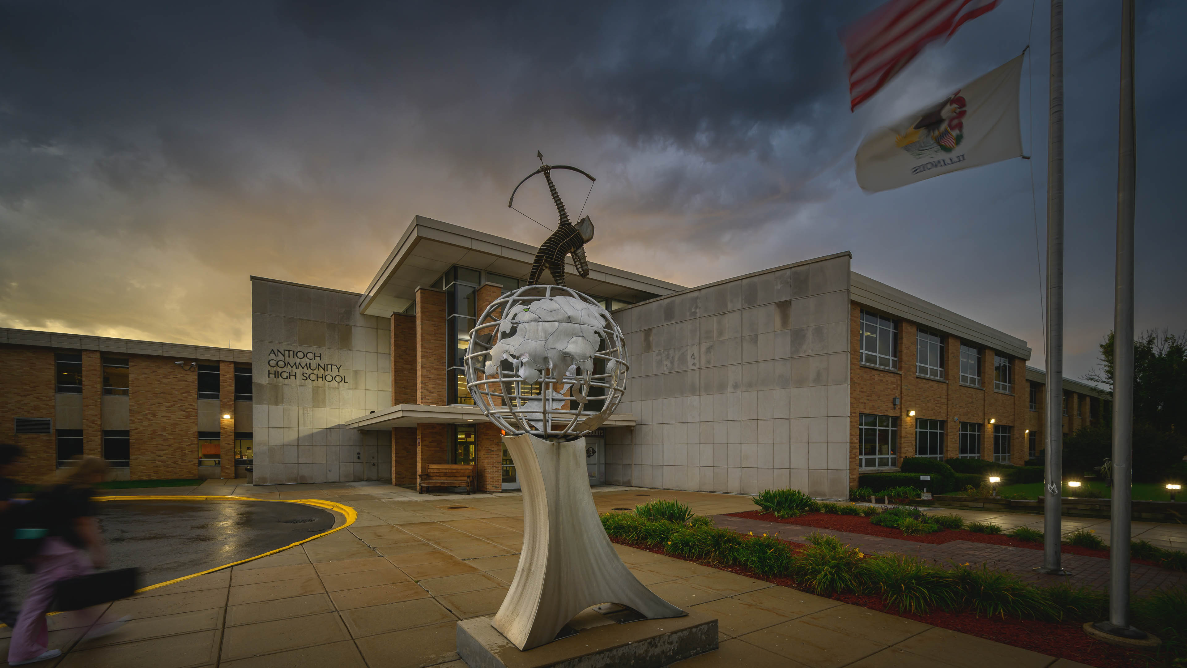archer statue in front of ACHS at sunrise.