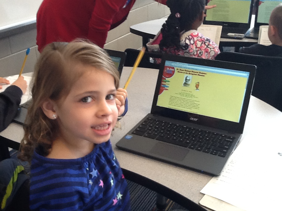 student in front of a laptop