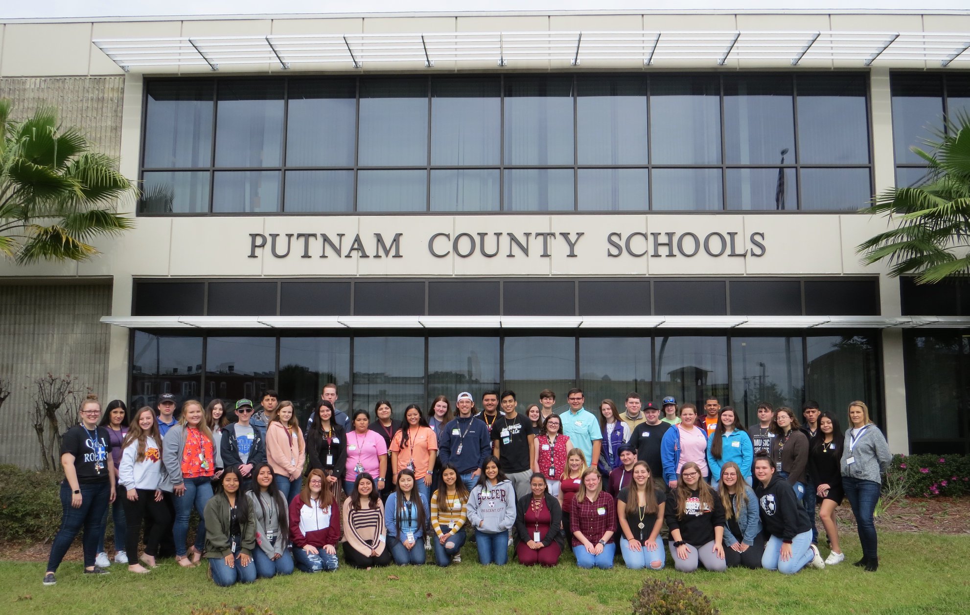 students in front of school building