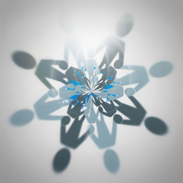 Paper snowflake cutout with people shapes.