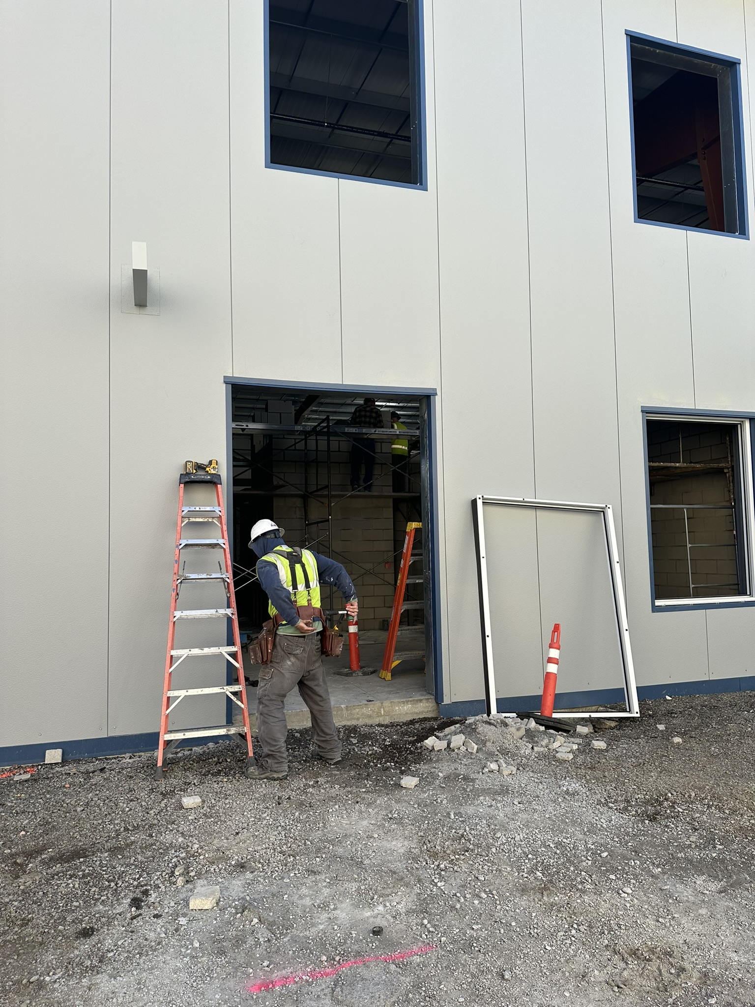 construction worker working on Wildcat Center