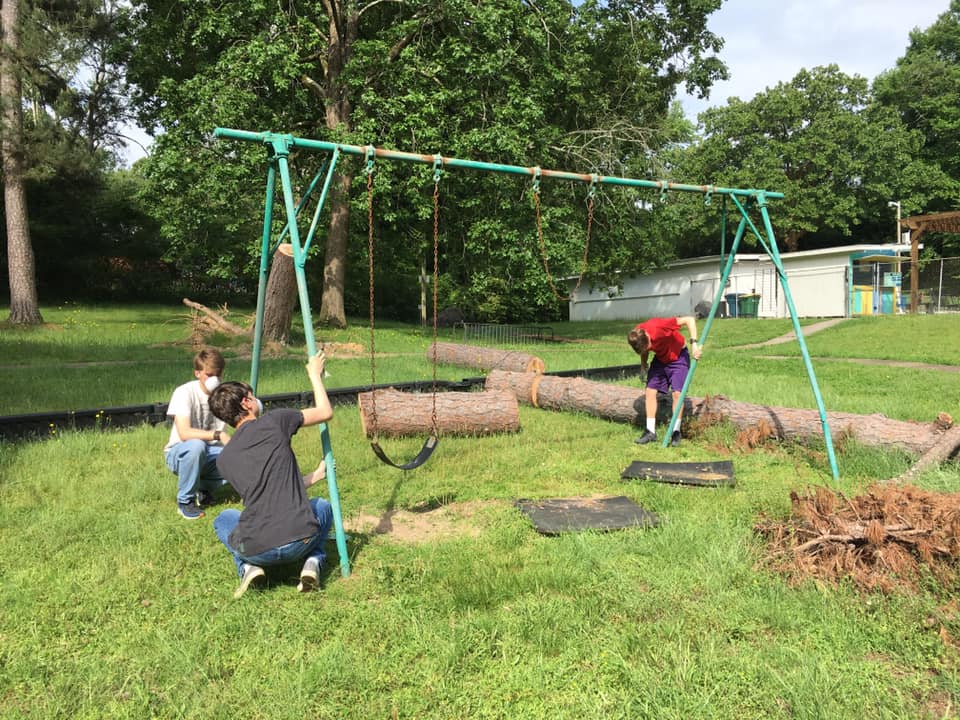 Eagle Scout Candidates repair swingset