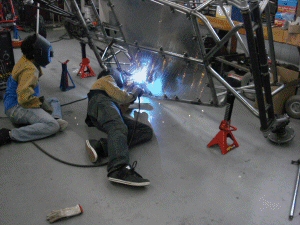 Casey and Ed welding out the bottoms of the Floor tabs