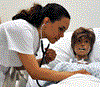 Student nurse checking heartbeat of a patient