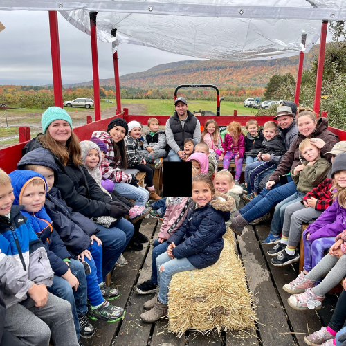 The community coming together for a hay ride during the fall