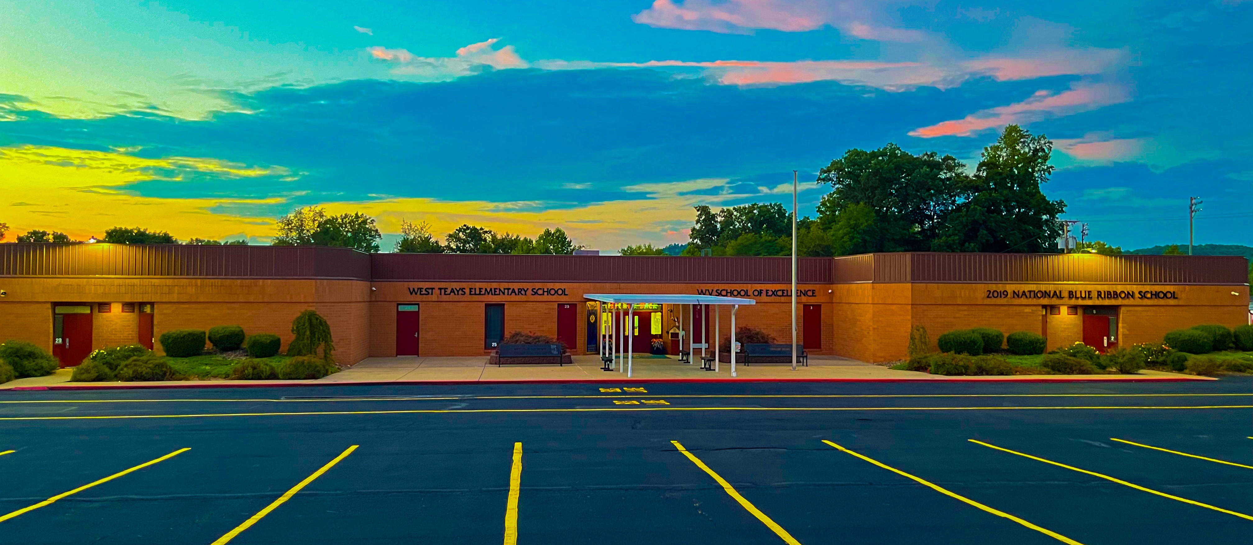 a picture of the sun set over west teays elementary school
