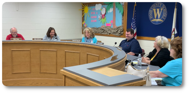 wood county schools board members and superintendent at board meeting