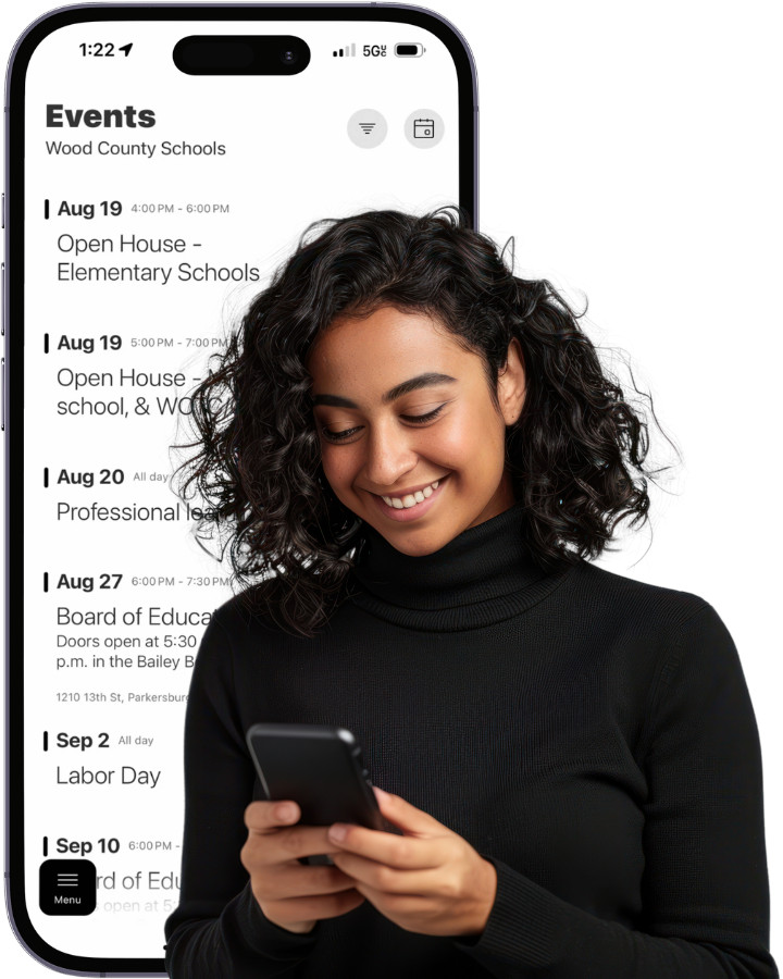 image of iphone with wood county schools' calendar on the screen - secondarily, there is a woman in the foreground looking at a cell phone