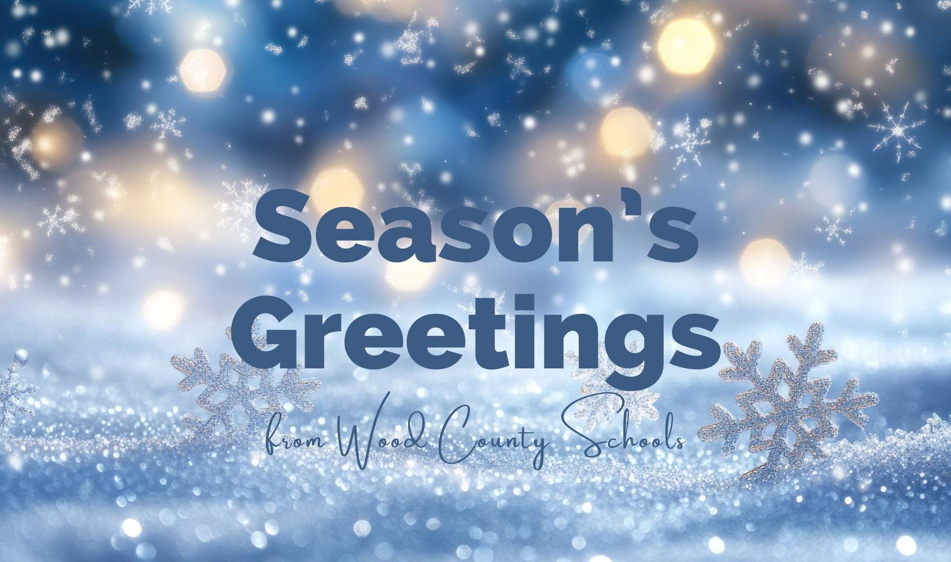 season's greetings from wood county schools - with blue and white shaded snowy scene