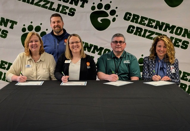 Photo Caption: Sitting, Left To Right: Jill Parsons, CEO/President, Chamber of Commerce of the Mid-Ohio Valley; Kecia Barr, Marketing Director, First Settlement Physical Therapy; Brett Ubbens, Principal, Greenmont Elementary School; Christie Willis, Superintendent, Wood County Schools; Standing: Jordan Downer, IT Director, First Settlement Physical Therapy