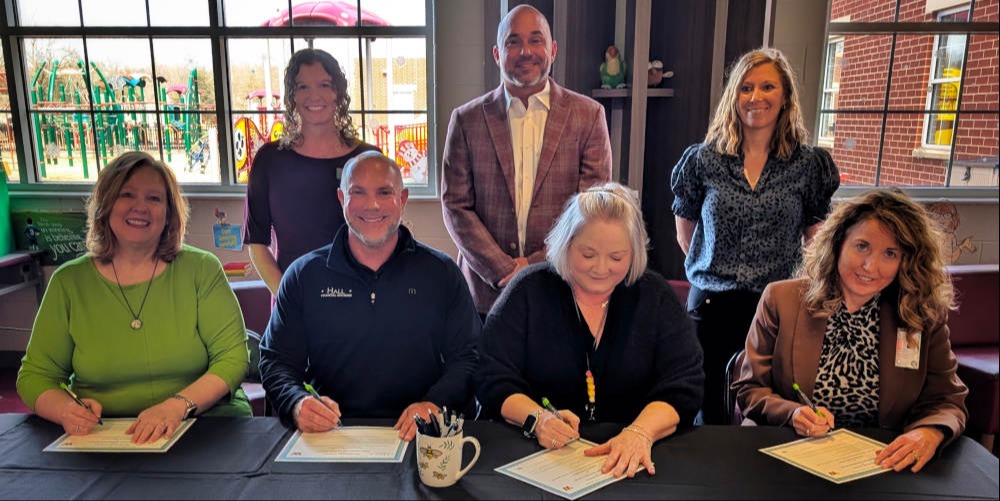 Photo Caption: Front Row, left to right: Jill Parsons, President/CEO, Chamber of Commerce of the Mid-Ohio Valley; Chris Hall, Founding Partner/CEO, Hall Financial Advisors; Lee Ann Cumpston, Principal, Williamstown Elementary School; Christie Willis, Superintendent, Wood County Schools. Back Row, left to right: Amber Blasczyk, Liaison, Hall Financial Giving Foundation; Rob Blasczyk, Senior Financial Advisor Partner, Hall Financial Advisors; Tori Dixon, Assistant Principal, Williamstown Elementary.