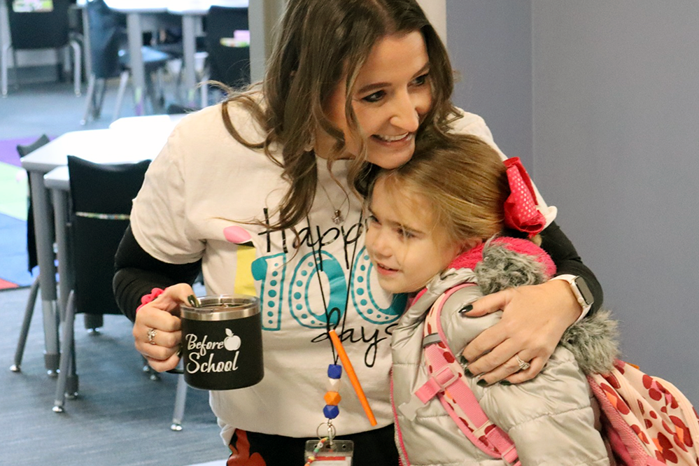 Skyway Teacher Access l Clark-Pleasant Schools Teacher Hugging Student