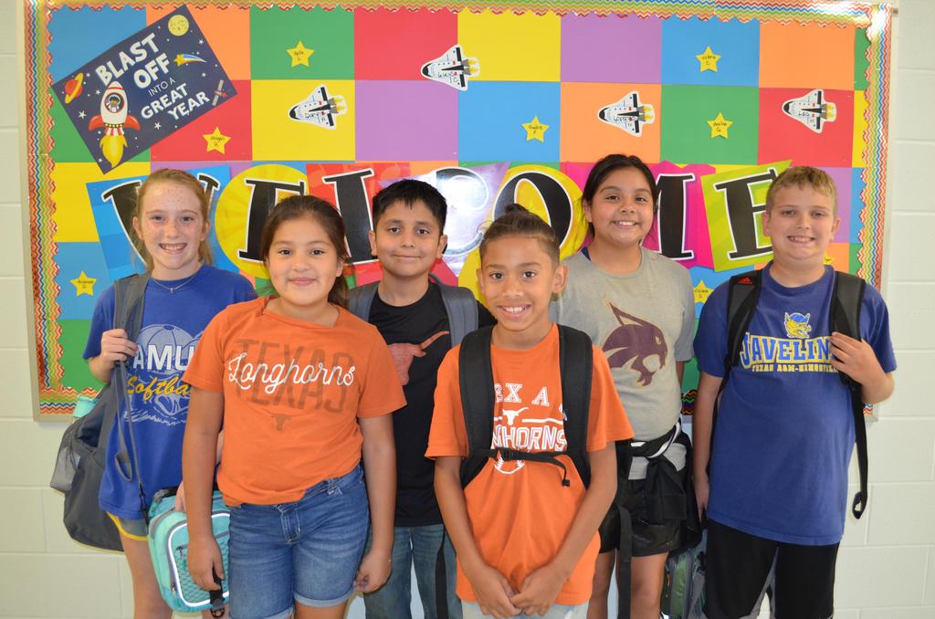 Photos of the National College Colors Day. The students wearing the college's jersey.