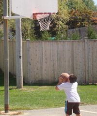 A photo of a student playing basketball.