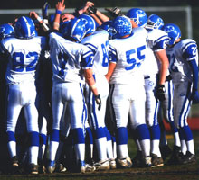 A photo of the football team in the field.