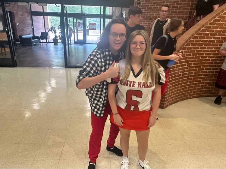 two students wearing red and white
