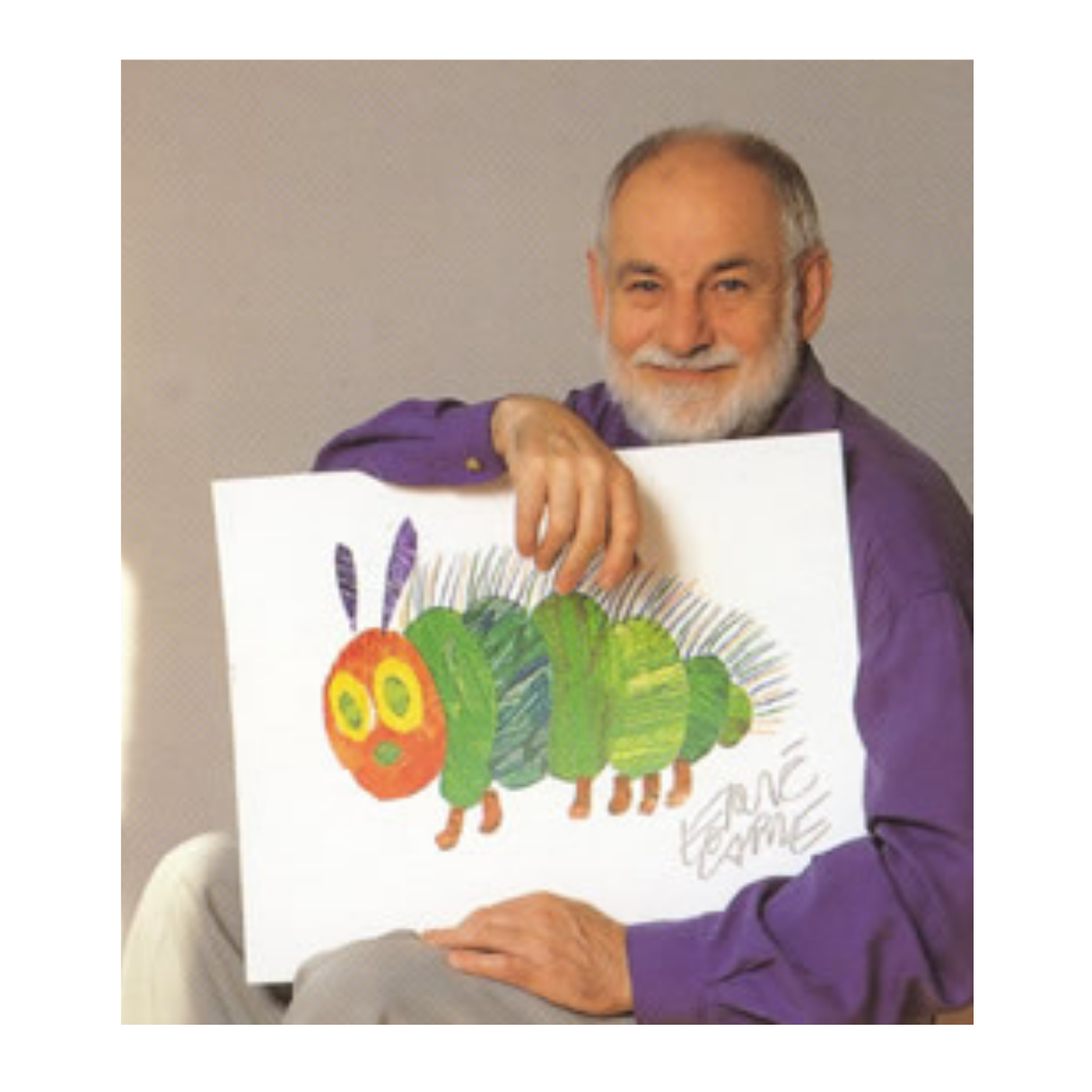 Eric Carle with a drawing of the Very Hungry Caterpillar