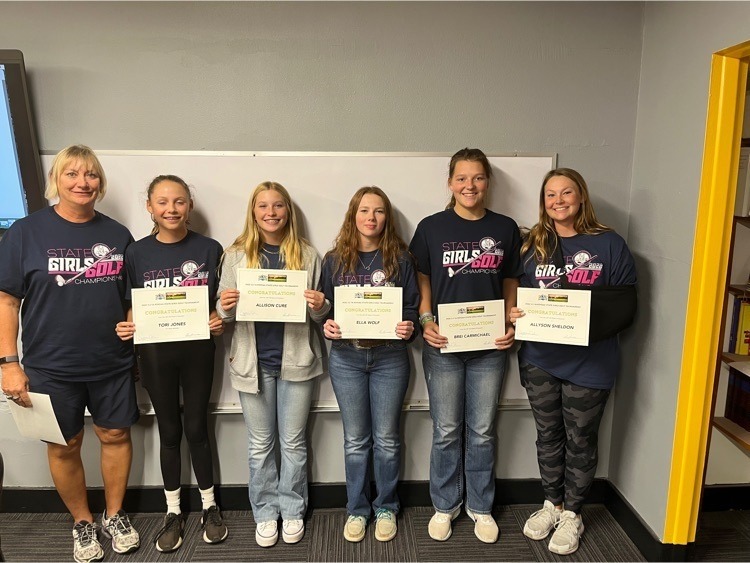 group of girls with awards certificates