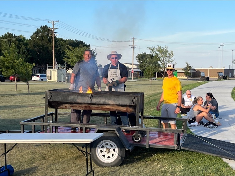 Staff members grilling