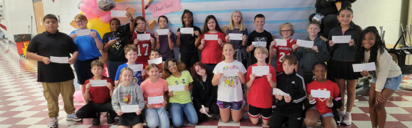 Students in the left picture are doing a science lab. Congratulations to the 2 students in the middle on their award. students on the left are working hard in class.