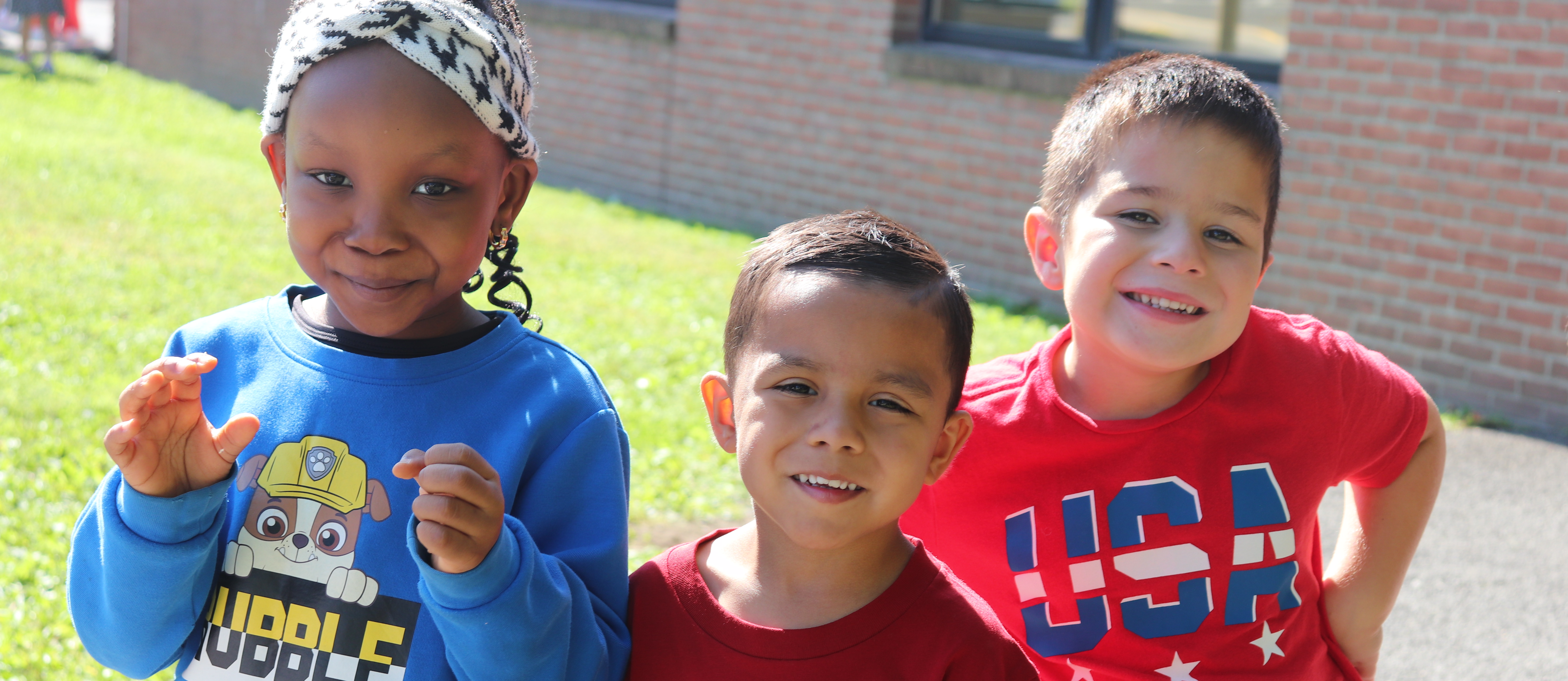 Three students wearing patriotic colors