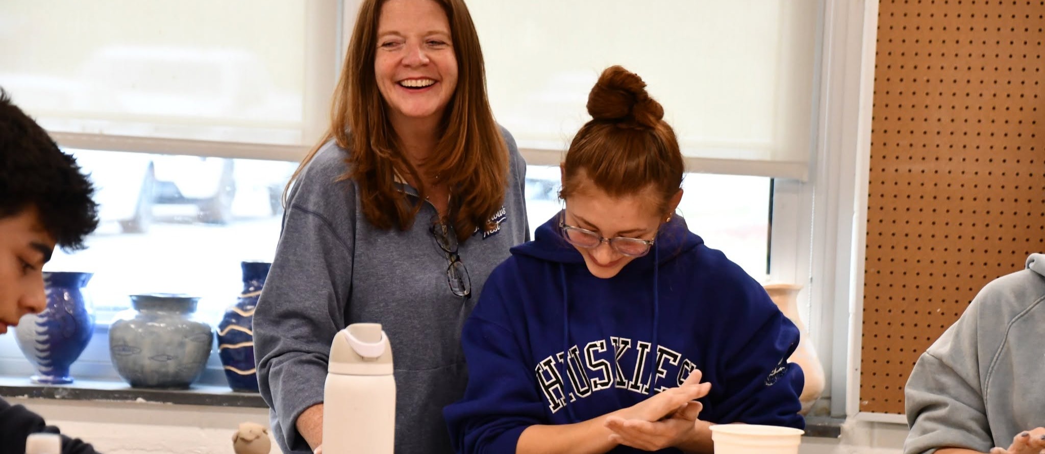 teacher and student laughing