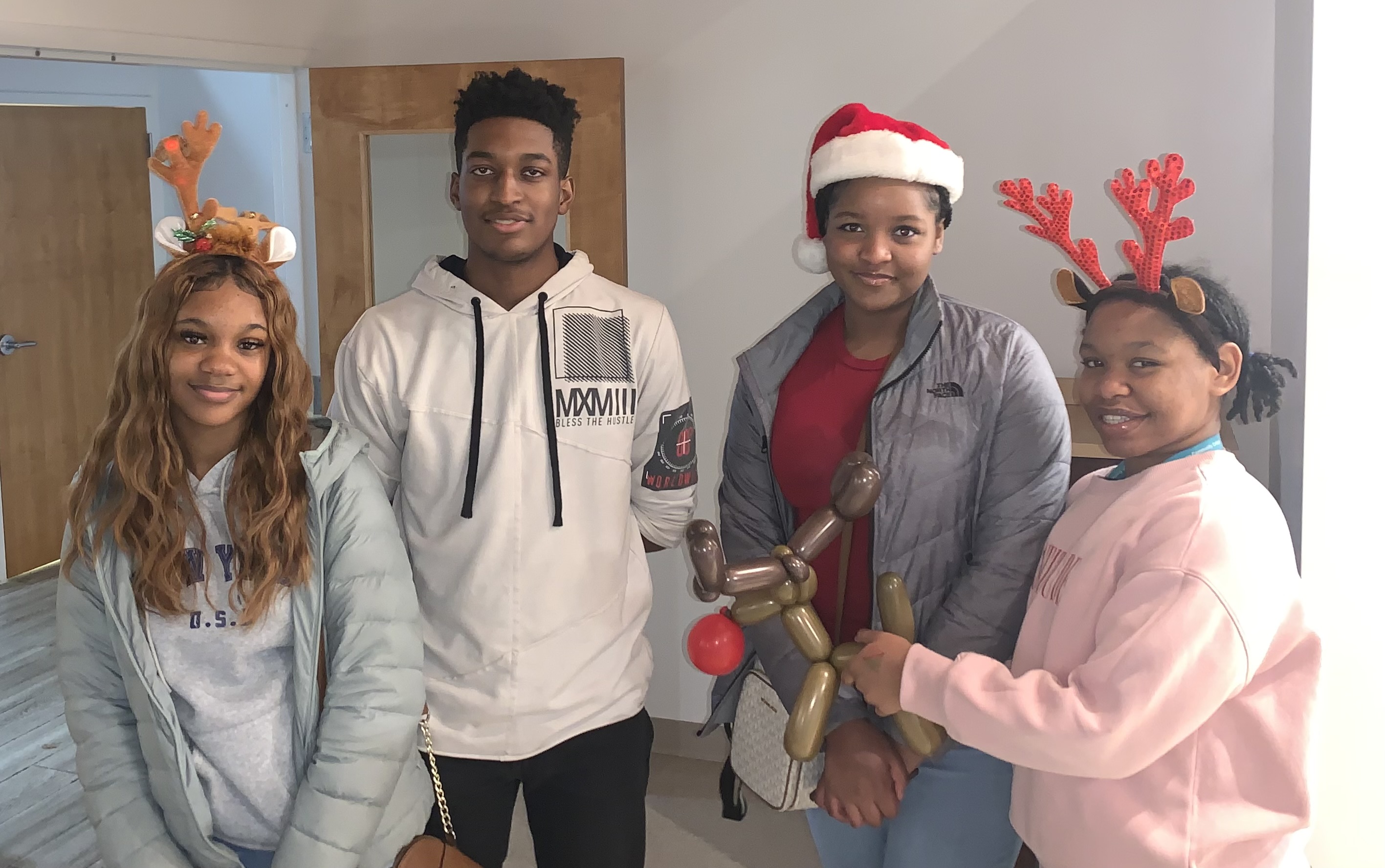 National Honor Society students posed in santa costumes