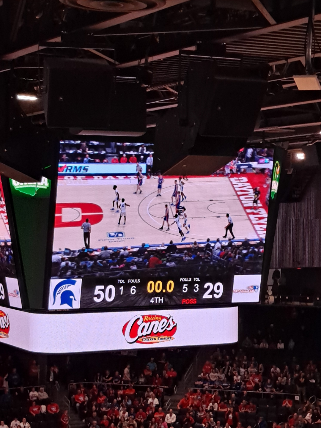 photo of jumbotron fo spartan basketball team winning the game includes score 50-29